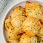 A bowl of golden brown garlic knots.
