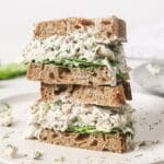 Two dill pickle chicken salad sandwiches stacked.