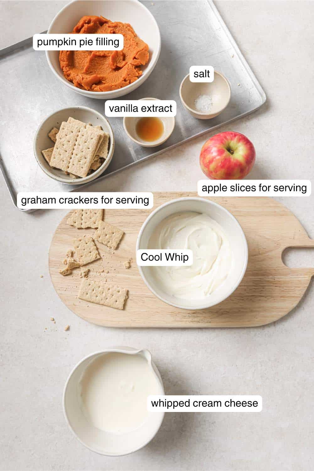 Small bowls with pumpkin pie filling, Cool Whip, whipped cream cheese and salt.