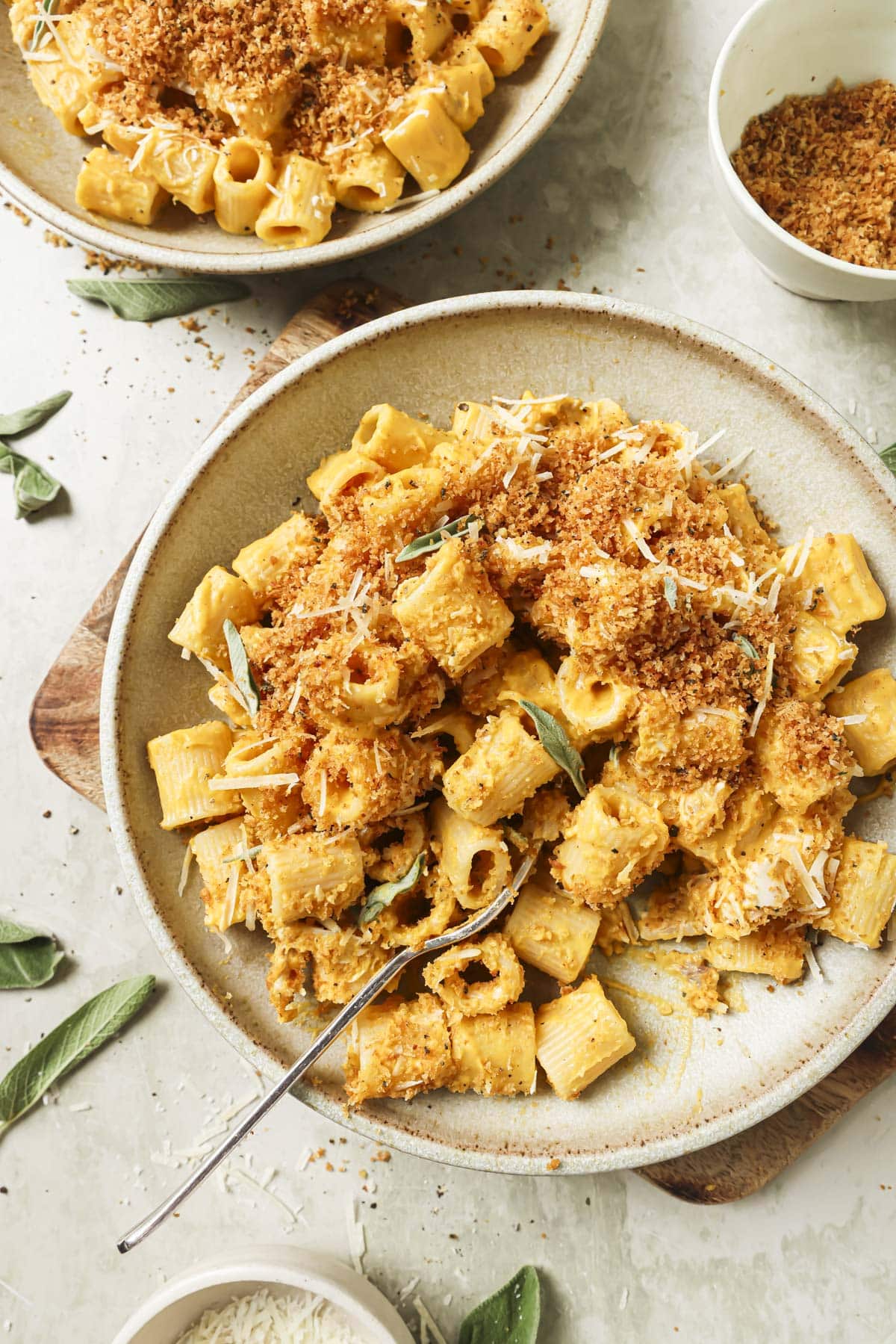 Butternut squash pasta on a plate with a fork.