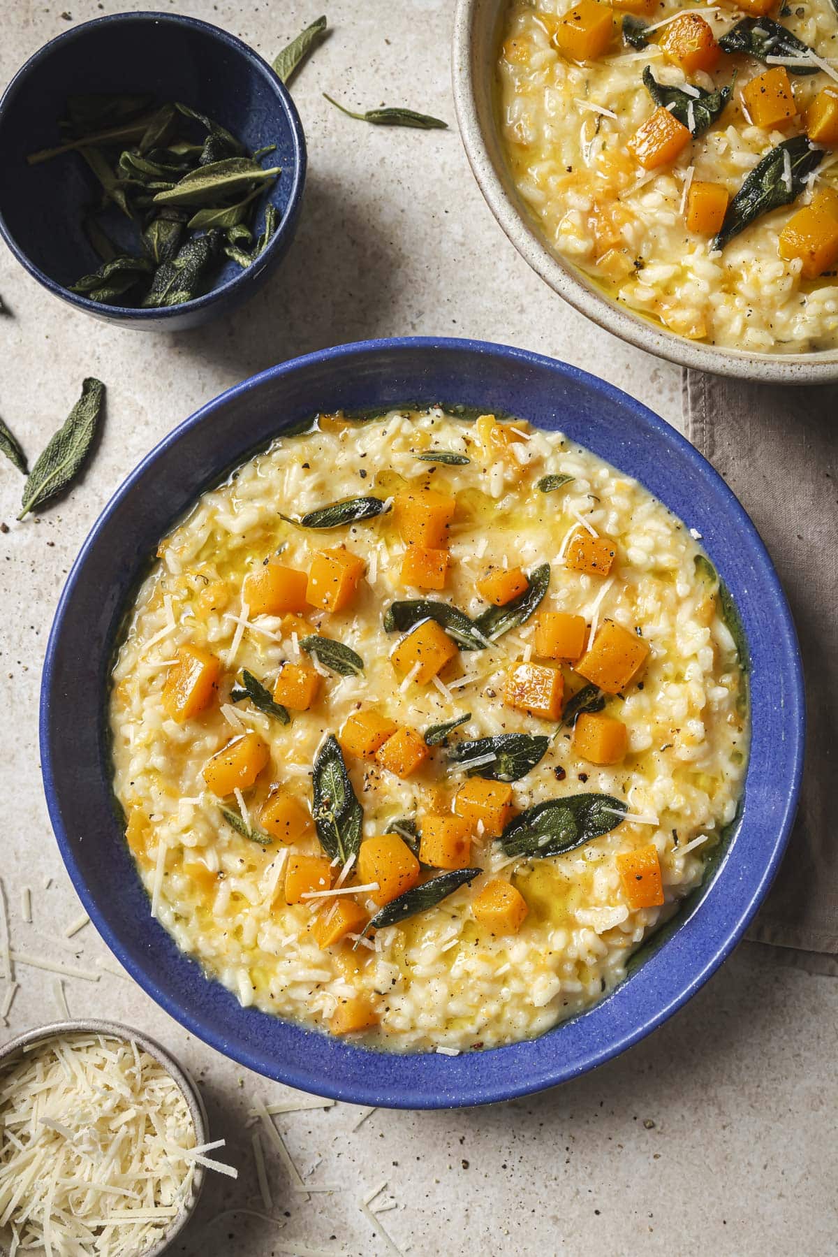 Butternut squash risotto served in a blue bowl.