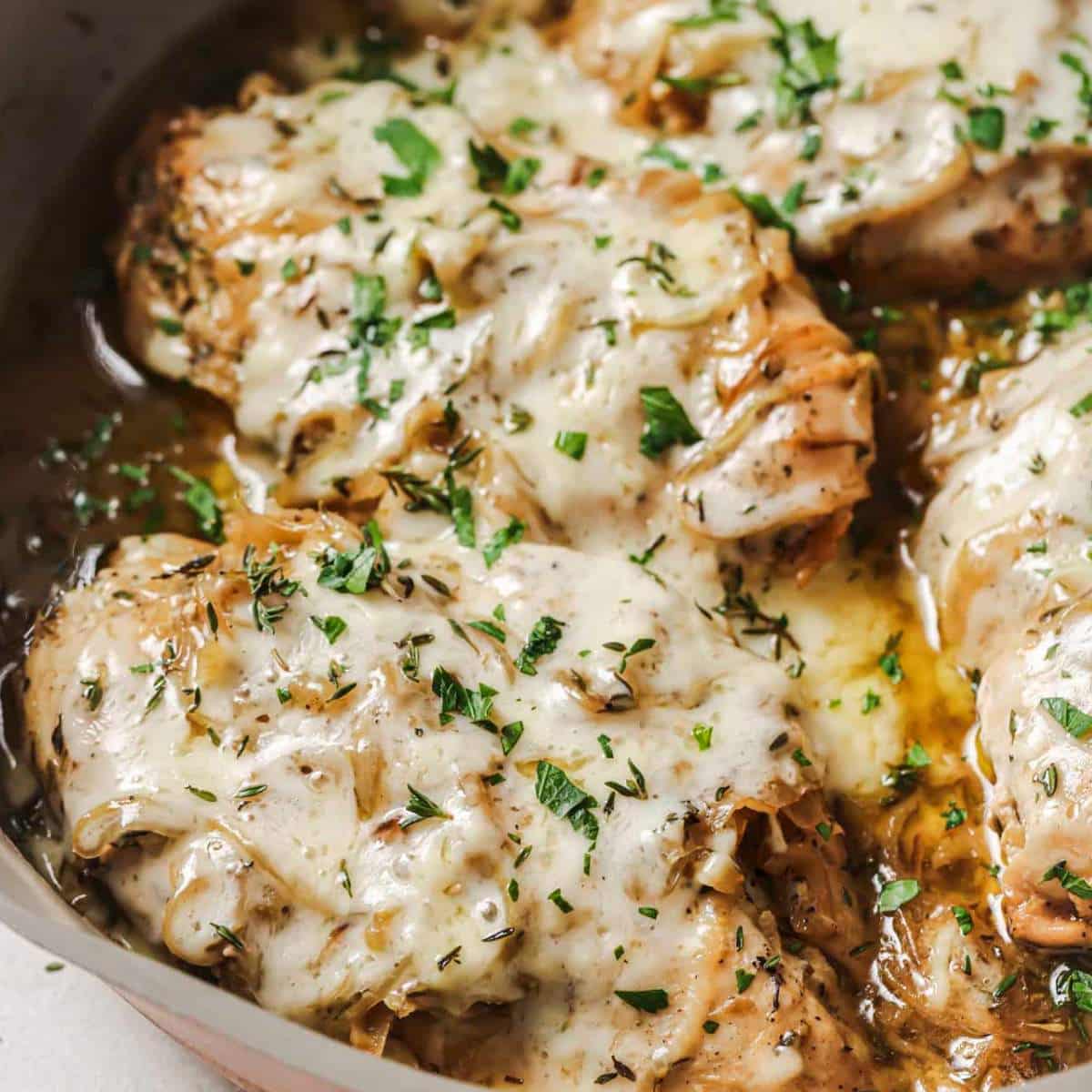 French onion chicken in a pan.