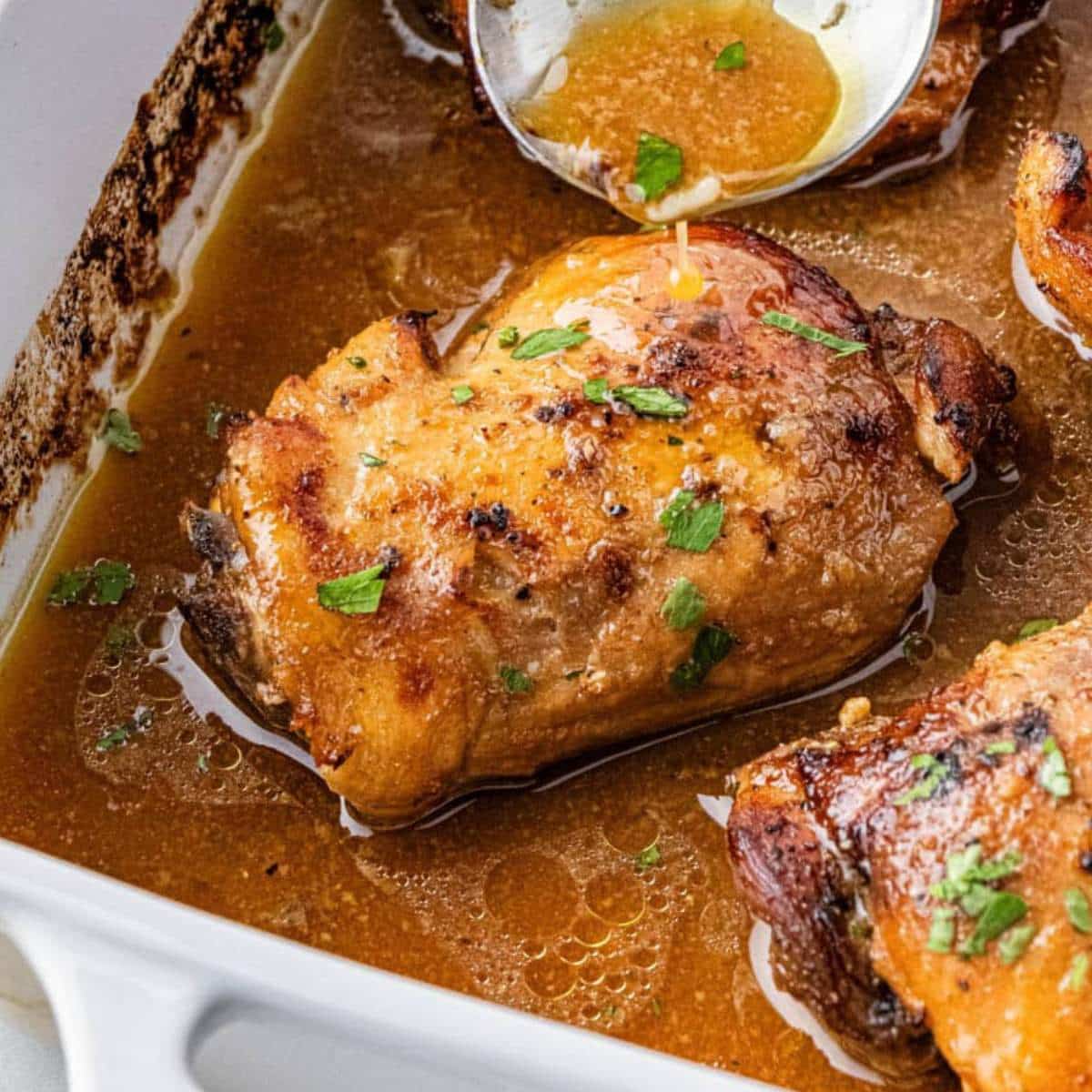 Chicken thighs in a dish.