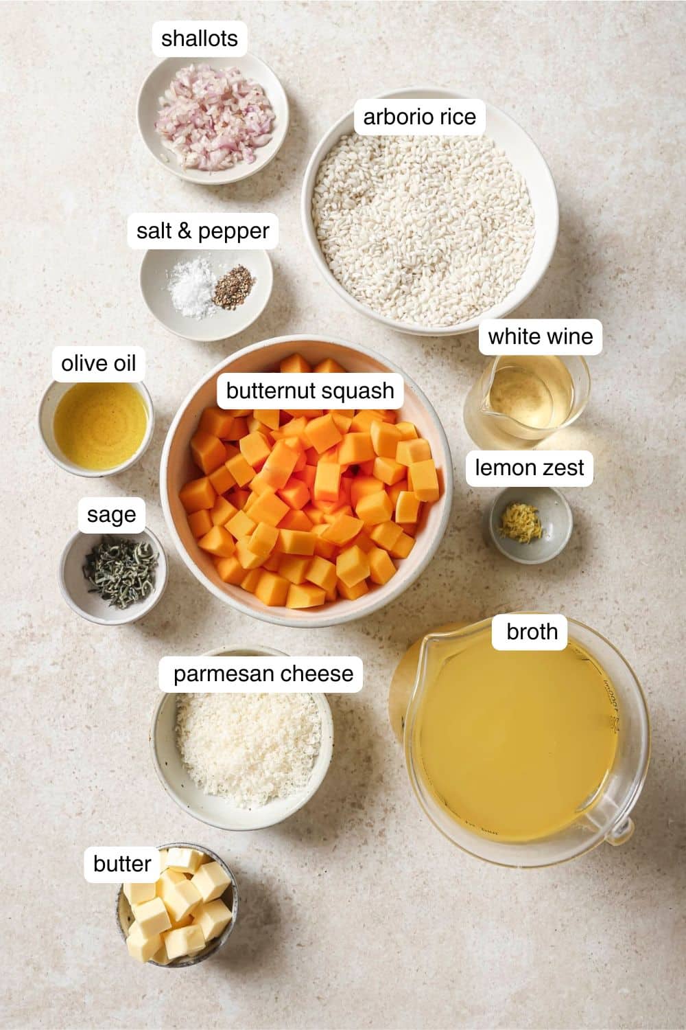 Small bowls with ingredients like butternut squash, broth, white wine, olive oil and fresh sage.
