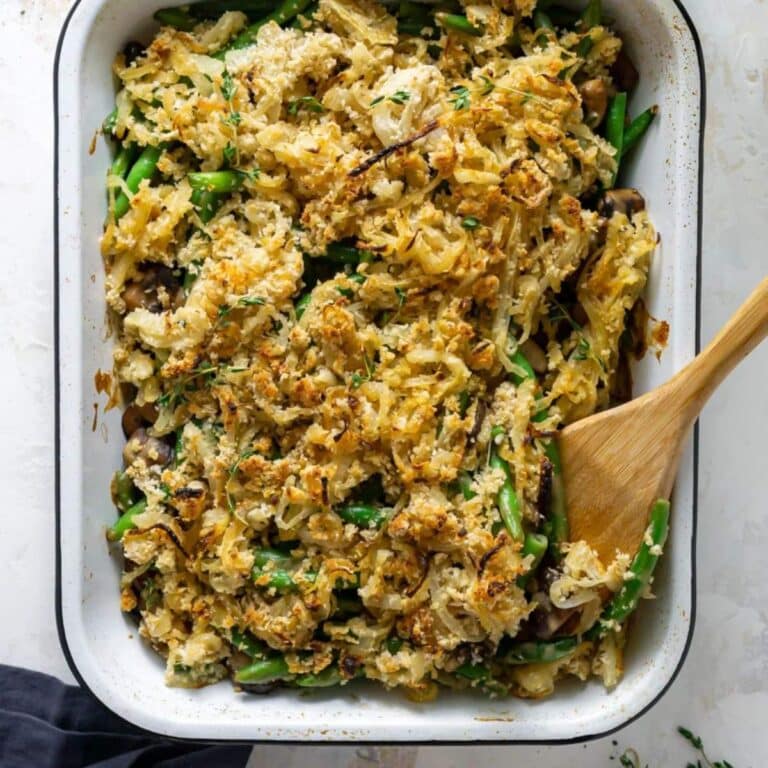 Green bean casserole in white baking dish.