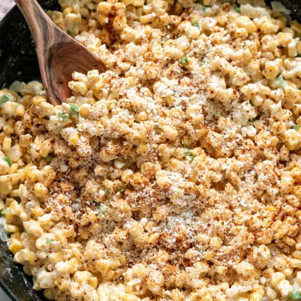 Creamed corn in cast iron skillet.