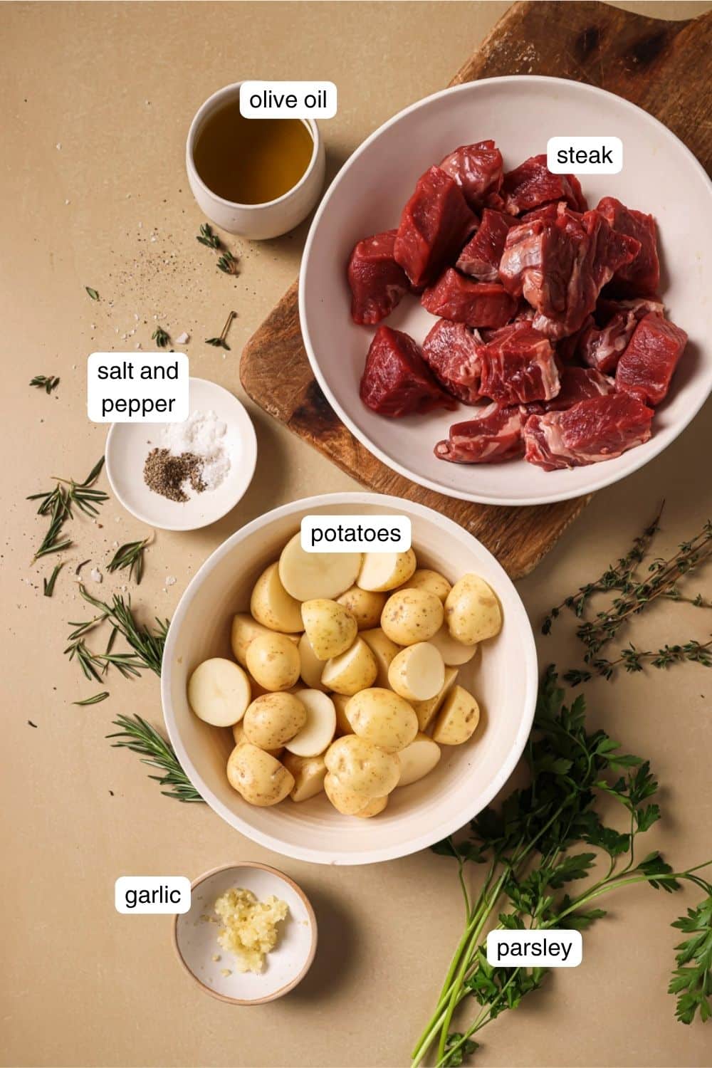 Labeled ingredients for air fryer steak and potatoes.