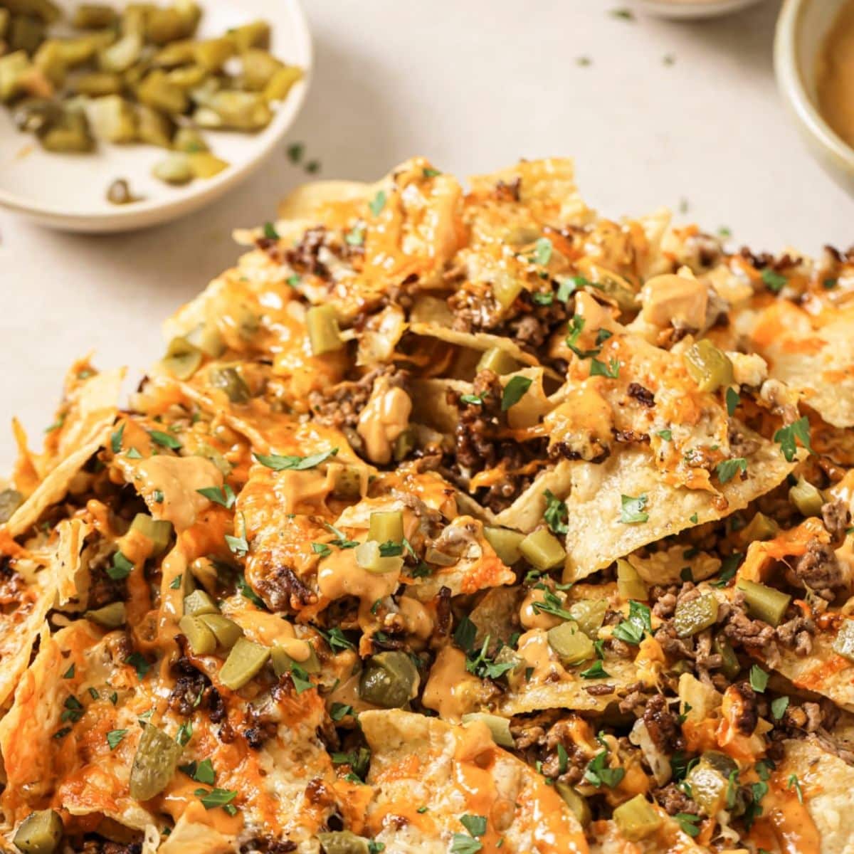 A plate of air fryer nachos with fixins.