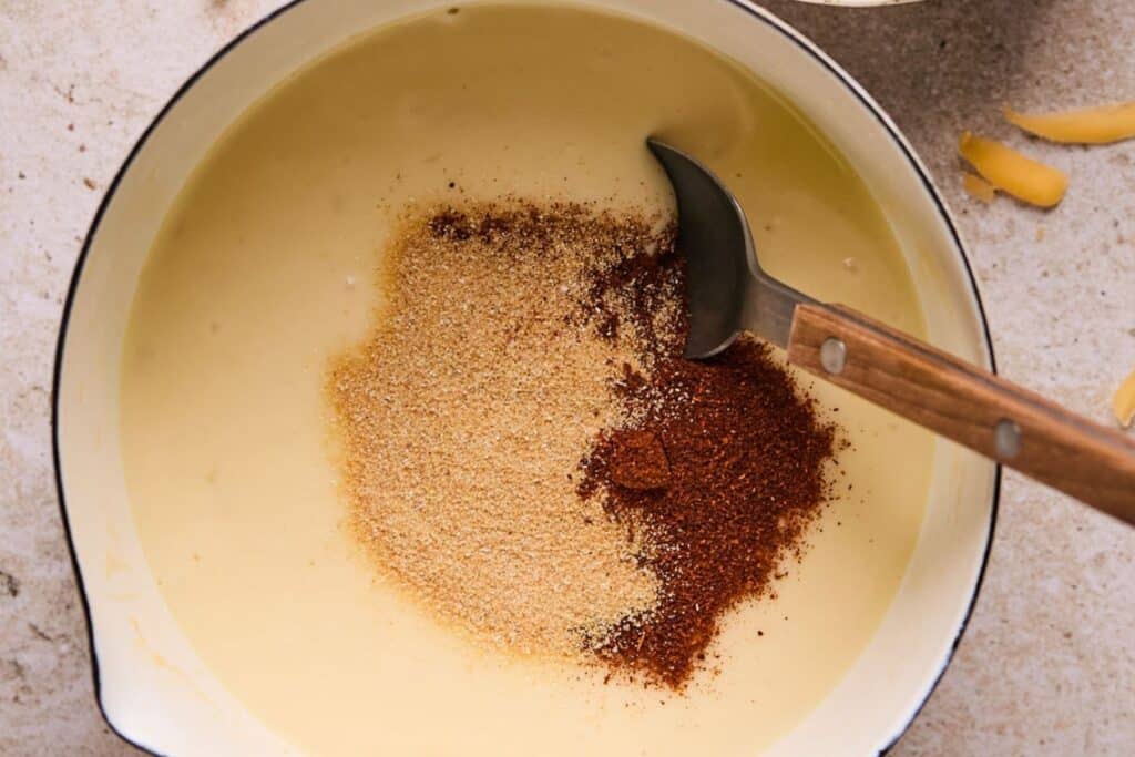 Mixing queso dip in a large pot.