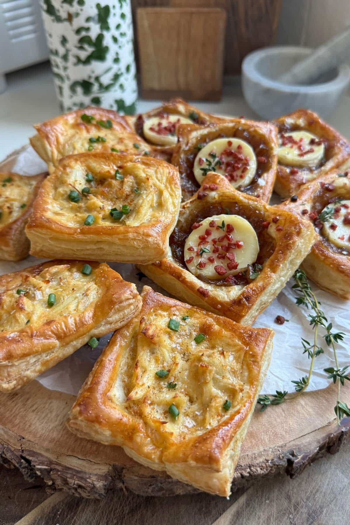 Crab puffs served alongside puff pastry brie bites.
