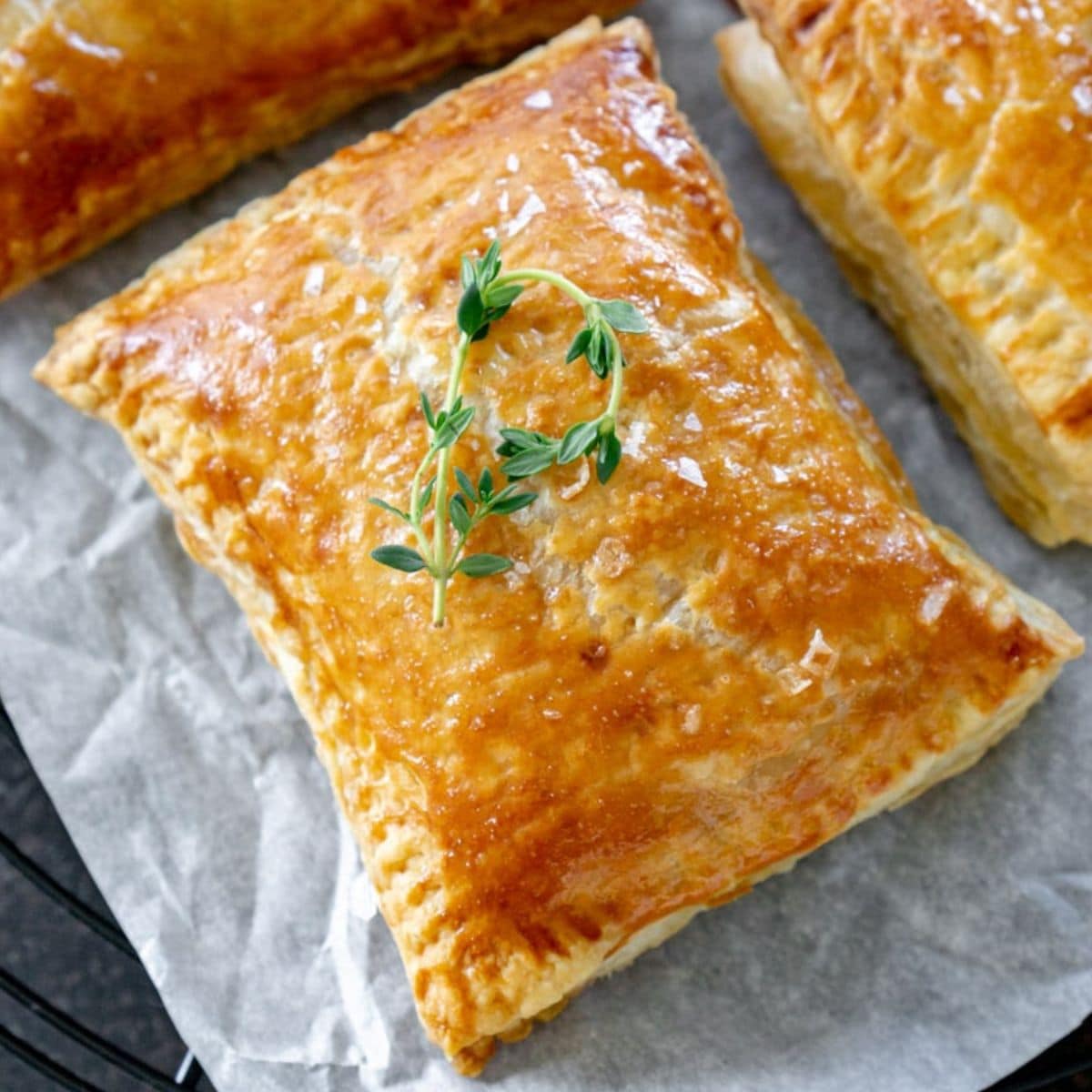 Cranberry apple hand pies on parchment paper.