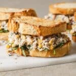 mexican street corn chicken salad piled in between two slices of toasted sourdough