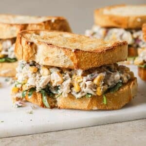 mexican street corn chicken salad piled in between two slices of toasted sourdough