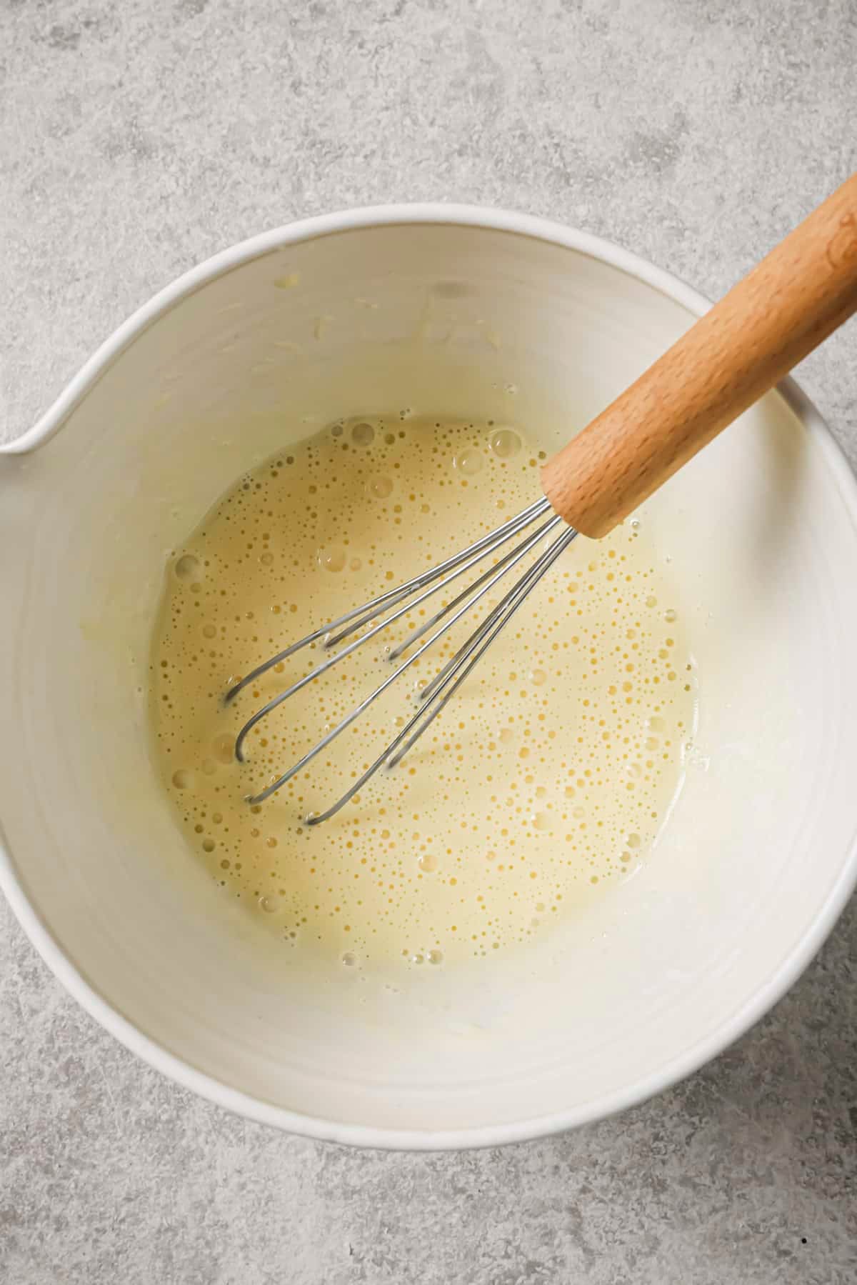 egg and mayo mixed into a bowl for dipping the chicken
