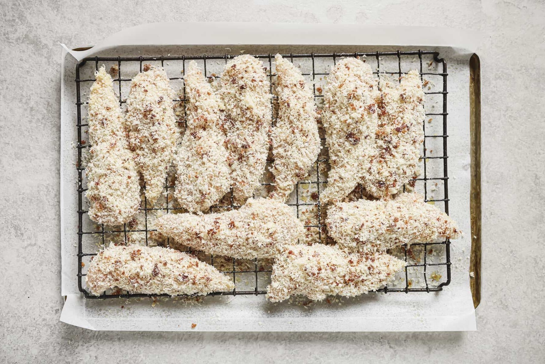 the coated bacon ranch chicken on a wire rack before baking