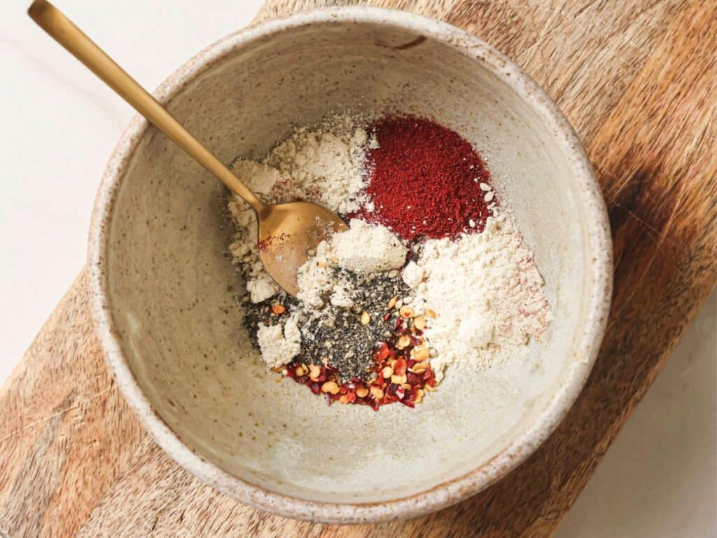A bowl of seasonings before combined. 