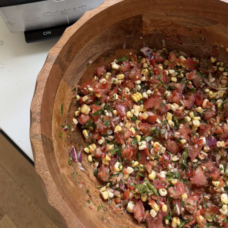 Corn salsa in a large wooden bowl.