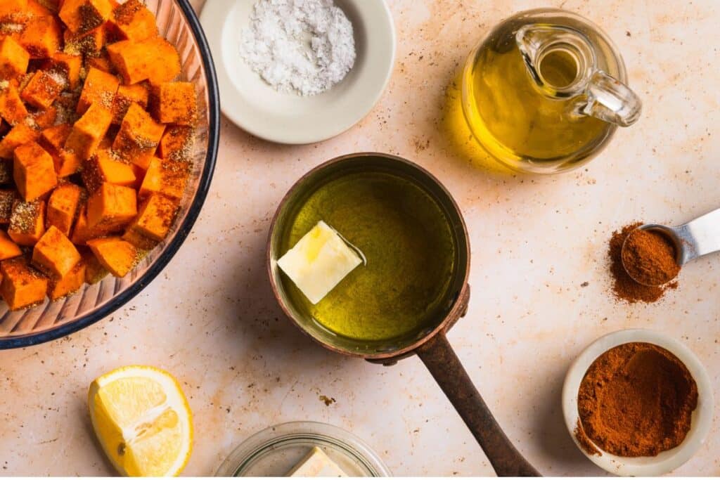 A pot with the ingredients to make honey butter.