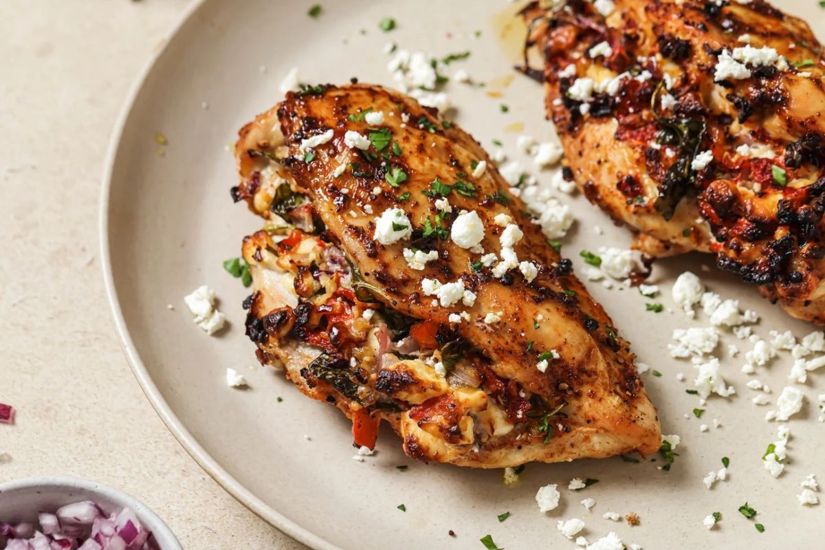 Air fried stuffed chicken breast topped with parsley and feta crumbles. 
