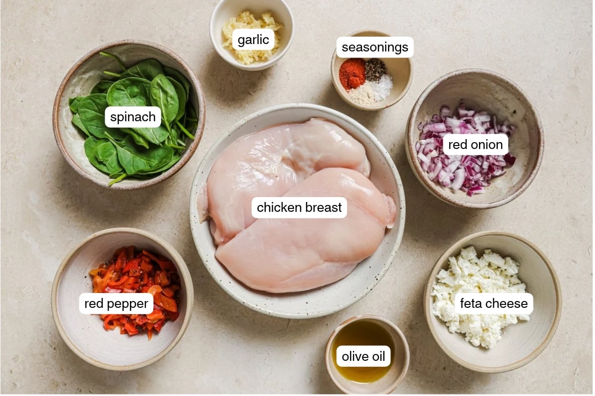 Flat lay of labeled ingredients for air fryer stuffed chicken breast.